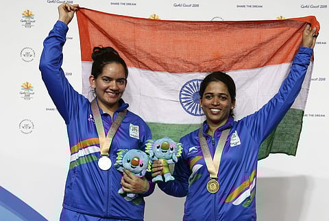 Winner Tejaswini Sawant (R) and Anjum Moudgil, silver, pose with their national flag during the women's 50m Rifle 3P final during the 2018 Commonwealth Games in Brisbane, Australia. | AP