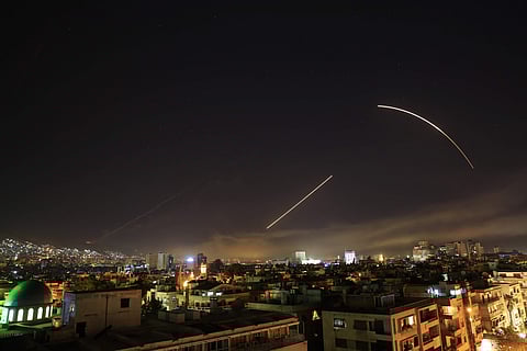 Missiles streak across the Damascus skyline as the U.S. launches an attack on Syria, early Saturday, April 14, 2018. | AP