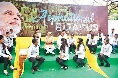 PM Narendra Modi interacts with youngsters on Saturday in Maoist affected Bijapur, identified as among the 115 ‘aspirational districts’ by NITI Aayog | Express