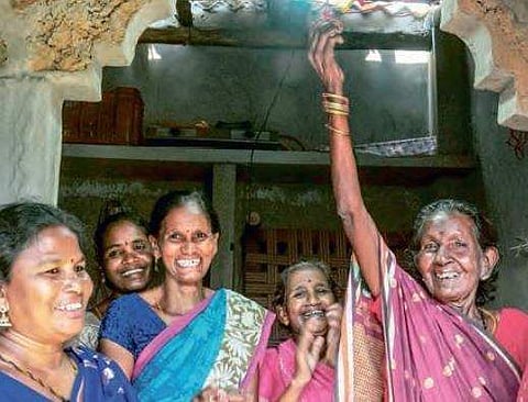 Residents of Indira Nagar celebrate by lighting the colony’s first bulb on Saturday | G SATYANARAYANA