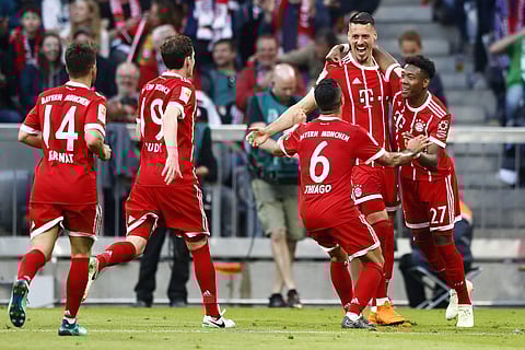 Bayern's Sandro Wagner, 2nd right, celebrates with team mates after scoring his side's second goal during the German Bundesliga soccer match between FC Bayern Munich and Borussia Moenchengladbach in Munich, Germany, Saturday, April 14, 2018.  | AP