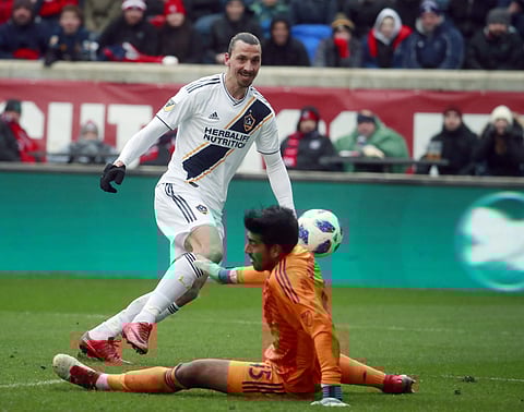 Chicago Fire goalkeeper Richard Sanchez (45), makes a save on a shot at close range by Los Angeles Galaxy forward Zlatan Ibrahimovic (9), during the first half of an MLS soccer match in Bridgeview, Ill., on Saturday, April 14, 2018. | AP