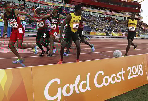 Members of the Jamaican team compete in the men's 4x400m relay at Carrara Stadium during the Commonwealth Games on the Gold Coast | AP