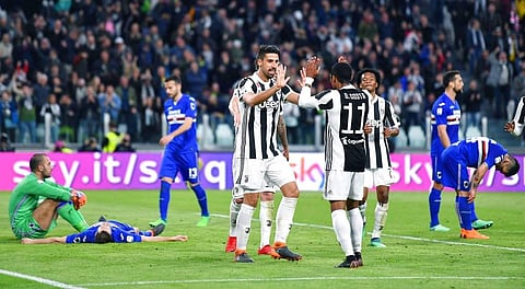 Juventus' Sami Khedira celebrates with teammate Douglas Costa after scoring his side's third goal during the Italian Serie A match between Juventus and Sampdoria at the Allianz Stadium in Turin, Italy. (AP)