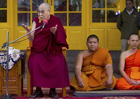 Tibetan spiritual leader Dalai Lama addresses the tourists at Tsuglakhang Temple Mcleodganj Dharamshala on Monday. | PTI