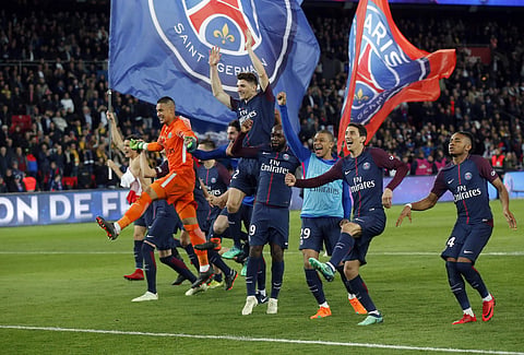PSG players celebrate at the end of the French League One match against Monaco | AP