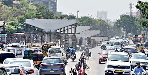 With construction of flyover in progress near Biodiversity Park junction, motorists have a tough time riding through the jam-packed road, in Hyderabad| r satish babu