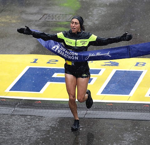 Desiree Linden, of Washington, Mich., wins the women's division of the 122nd Boston Marathon on Monday. (Photo: AP)