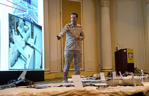 Col. Turki al-Malki, spokesman for Saudi-led coalition fighting the Huthi forces, displays what he said is wreckage from Iranian-Huthi suicide drones, during a press conference (File Photo | AP)