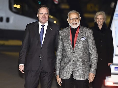 Prime Minister Narendra Modi, centre, is greeted by Swedish Prime Minister Stefan Lofven, left, on his arrival at Arlanda Airport in Stockholm, Sweden, Monday April 16, 2018. (Photo: AP)