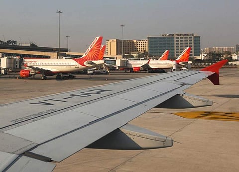 Air India passenger planes are seen parked at the Chhatrapati Shivaji International airport in Mumbai. (Photo | Reuters)