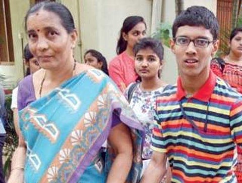 Cerebral palsy patient Madhukesh on his way to a CET centre in the city on Wednesday | NAGARAJA GADEKAL