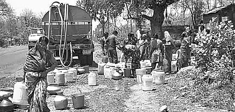 File photo of slum dwellers collecting drinking water from a tanker | Express
