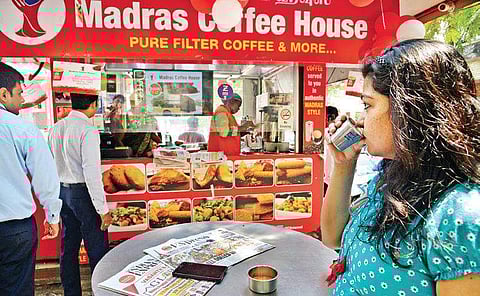 Top: Customers enjoy a fresh brew of saffron tea at a Madras Coffee House outlet  Bottom: The Saffron  essence tea
