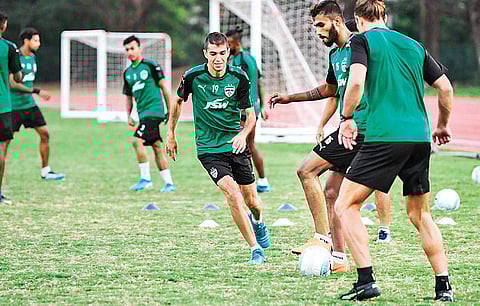 Bengaluru FC players during a practice session at the Kalinga Stadium training facility ahead of their Super Cup final against East Bengal in Bhubaneshwar. (EPS)
