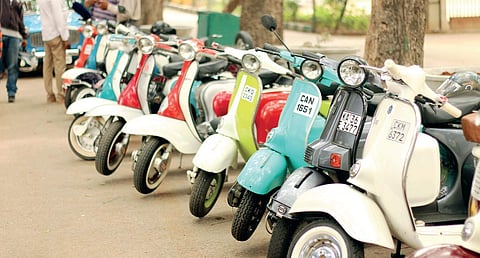 Owners of vintage scooters have formed an exclusive club, and (R) the club’s founder Vishal Agarwal