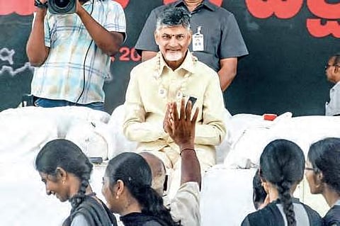 Chief Minister N Chandrababu Naidu greets visitors during his day-long hunger strike, Dharma Porata Deeksha, in Vijayawada on Friday | RVK RAO