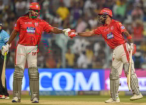 Kings XI Punjab batsman KL Rahul is greeted by his teammate C Gayle after completing his half century during IPL cricket match against KKR at Eden Garden in Kolkata on Saturday.(PTI)