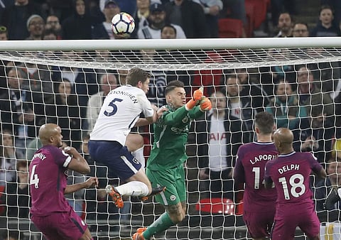 Manchester City goalkeeper Ederson makes a save during the English Premier League soccer match between Tottenham Hotspur and Manchester City at Wembley stadium in London, England, Saturday, April 14, 2018. | AP