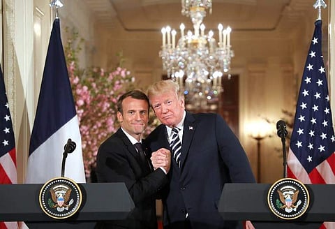 US President Donald Trump and French President Emmanuel Macron hold a joint press conference at the White House in Washington. | AFP