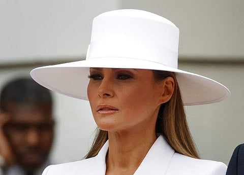First lady Melania Trump waits with President Donald Trump to greet French President Emmanuel Macron and his wife Brigitte Macron during a State Arrival Ceremony on the South Lawn of the White House. | AP
