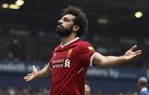 Liverpool's Mohamed Salah celebrates scoring his side's second goal of the game, during the English Premier League soccer match between West Bromwich Albion and Liverpool, at The Hawthorns, West Bromwich, England, Saturday. (AP)