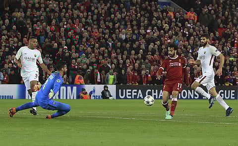Salah produced two world-class finishes in the first half then set up further goals for Sadio Mane and Roberto Firmino to help his team into a scarcely believable five-goal lead in the Champions League semifinals. In pic: Liverpool's Mohamed Salah scores his side's second goal of the game against Roma during their Champions League, Semifinal first leg soccer match at Anfield. (Photo | AP)
