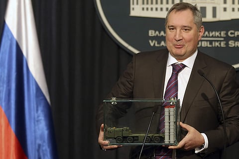 A file image of Russian Deputy Prime Minister Dmitry Rogozin holding a model of an S-300 surface-to-air missile system at a news conference in Belgrade, Serbia. (File | AP)
