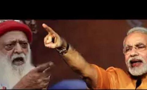 Screengrab from Congress' video showing PM Modi with Asaram Bapu. (Twitter | Congress)