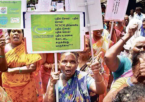Fishing community protesting in front of Chennai Collectorate on Wednesday. | EXPRESS