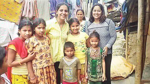 Simran Oberoi Multani (in yellow top) with slum kids during a distribution drive