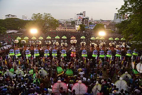 The display of ornate parasols known as Kudamattom at the southern entrance of Vadakkumnathan temple. Express | Albin Mathew