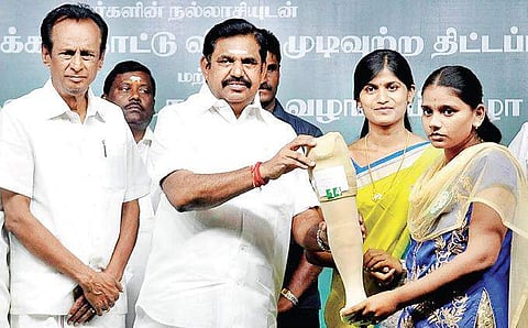 Chief Minister Edappadi K Palaniswami distributing a prosthetic limb to a beneficiary, in Edappadi on Friday | Express