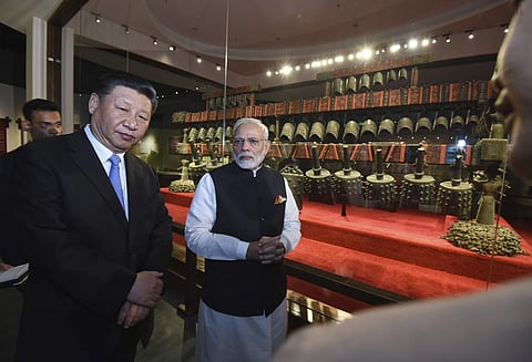 In this photo released by the Indian Ministry of External Affairs, Indian Prime Minister Narendra Modi, right, and Chinese President Xi Jinping visit the Hubei Museum in Wuhan, China, Friday, April 27, 2018. | AP