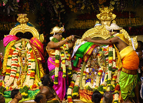 The celestial wedding of Meenakshi and Sundareswarar with elaborate arrangements took place yesterday at the Sri Meenakshi Sundareswarar temple, Madurai. IN PIC: Priest performing the celestial wedding. (Photo: EPSK.K.Sundar)