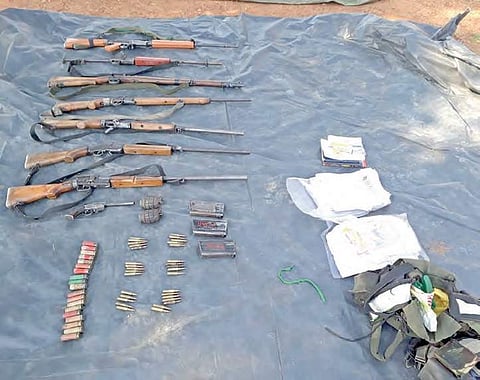 Weapons and a few documents  that were recovered from the encounter site that place at Telangana border on Friday  | Express