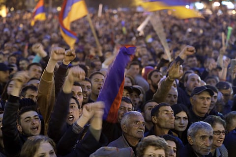 Protesters react while listening to their leader Nikol Pashinian in the town of Gyumri, Armenia, Friday, April 27, 2018. | Associated Press