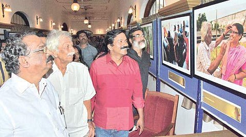 Cultural Affairs Minister A K Balan visiting the photo exhibition on the life of sculptor Kanayi Kunhiraman by Jithesh Damodar at the Kanakakunnu Palace in Thiruvananthapuram on Monday. Kanayi and Jithesh Damodar are seen| B P Deepu