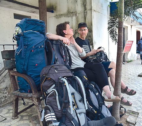 A couple from Germany waiting outside the South railway station on Monday morning.