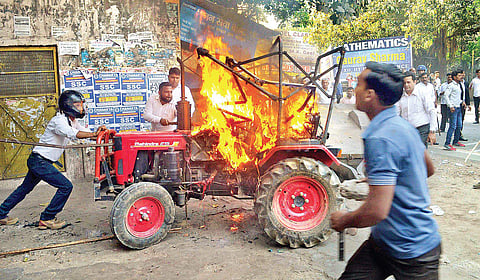 Protesters set afire a vehicle during the Bharat Bandh against the dilution of SC /ST Act at Meerut in Uttar Pradesh on Monday | pTI