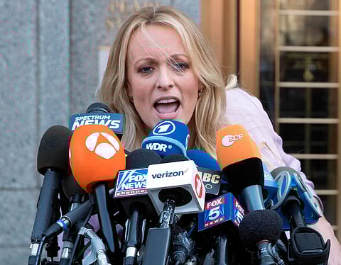 In this April 16, 2018 photo, adult film actress Stormy Daniels outside federal court in New York. Stormy Daniels filed a defamation complaint in federal court in New York on Monday. | AP