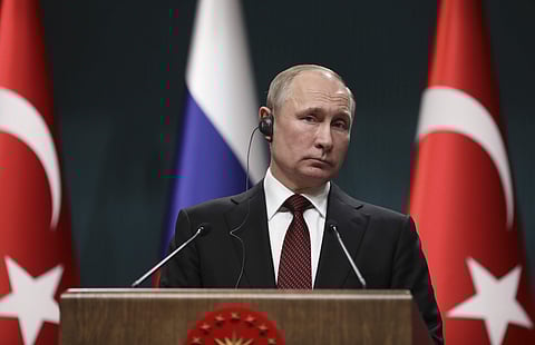 Russia's President Vladimir Putin, listens to a reporter's question during a joint news conference with Turkey's President Recep Tayyip Erdogan, following their meeting at the Presidential Palace in Ankara, Turkey, Tuesday, April 3, 2018. | Associated Pre