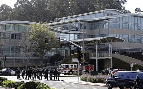 Law enforcement officials walk toward YouTube offices in San Bruno, Calif., Tuesday, April 3, 2018. | Associated Press