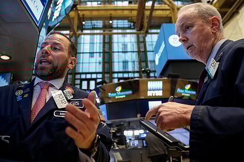 Traders work on the floor of the New York Stock Exchange (NYSE) in New York. (Photo | Reuters)