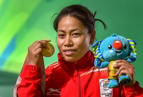 Gold medalist Indian weightlifter Sanjita Chanu poses for a photo during the medal ceremony of women's 53kg weightlifting event during the Commonwealth Games 2018. | PTI