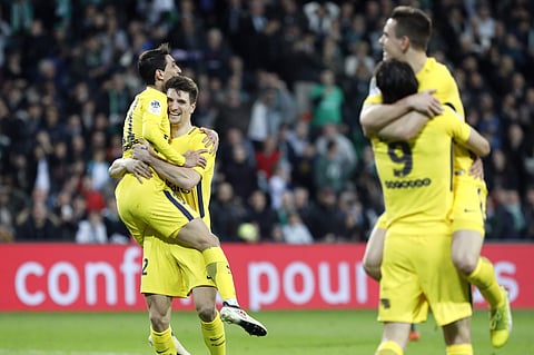 PSG's Thomas Meunier, left, celebrates with Angel Di Maria, as Giovani Lo Celso, right, celebrates with Roberto Edinson Cavani, after they scored a goal during the match against Saint-Etienne (AP)