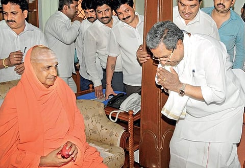 CM Siddaramaiah greeting Sri Shivarathri Deshikendra Swami at Suttur Mutt in Mysuru on Friday | Udayashankar s