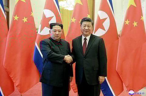 North Korean leader Kim Jong Un (left) and Chinese counterpart Xi Jinping. (File | AP)