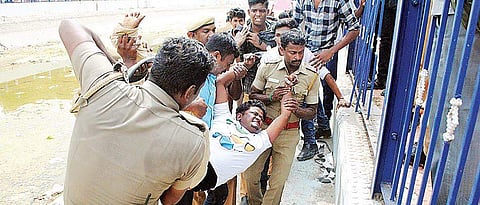 Students protesting for CMB formation being forcibly removed by police, near Anaicut canal in Thanjavur on Friday | Express