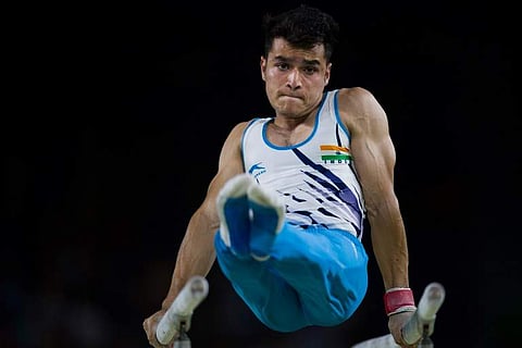 Yogeshwar Singh competes on the parallel bars during the men's team final. (Photo | AFP)